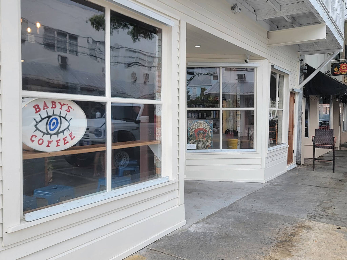 The white storefront of Baby’s Coffee at 518 Fleming Street in Old Town Key West